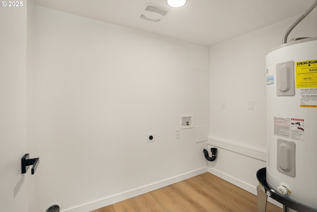 17349 Banyan Ln, Lake Oswego, OR 97034 - laundry room with water heater, light wood-style flooring, electric dryer hookup, hookup for a washing machine, and baseboards