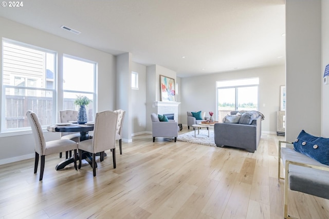 dining space with light hardwood / wood-style floors