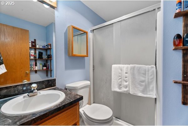 10514 NE 96th St, Vancouver, WA 98662 - full bath featuring vanity, a stall shower, and toilet