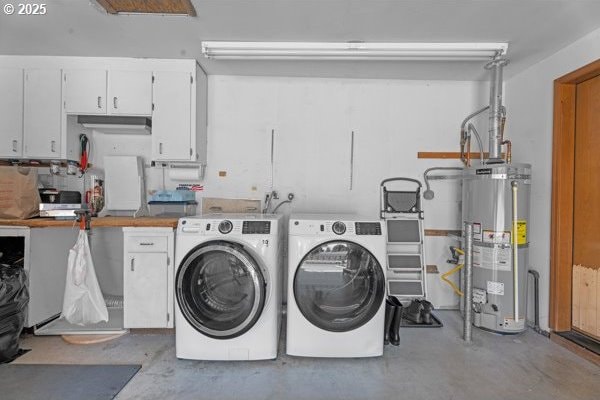 10514 NE 96th St, Vancouver, WA 98662 - laundry area with water heater, washing machine and clothes dryer, and cabinet space