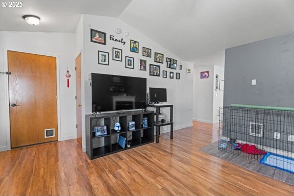 10514 NE 96th St, Vancouver, WA 98662 - living area featuring lofted ceiling, wood finished floors, and baseboards