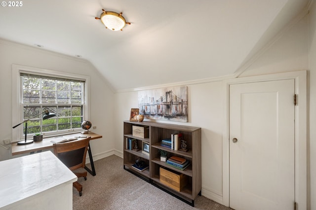 carpeted office featuring lofted ceiling and baseboards