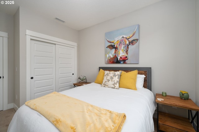 carpeted bedroom with a closet