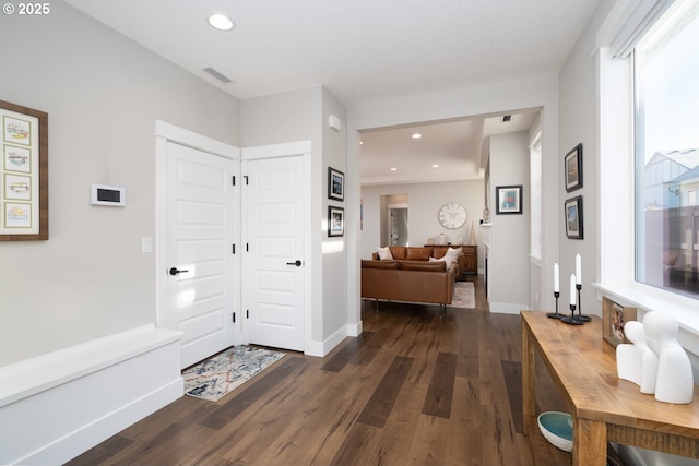 corridor with dark wood-type flooring