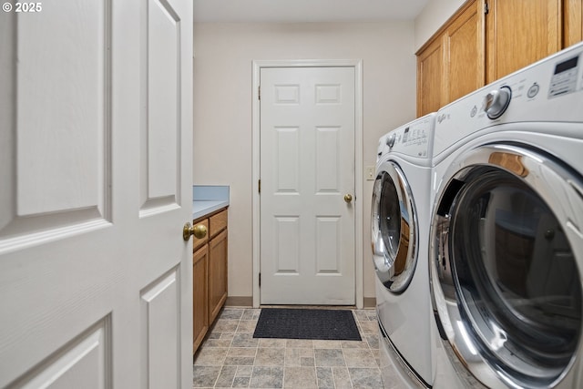 17958 Saint Clair Dr, Lake Oswego, OR 97034 - washroom featuring cabinet space, independent washer and dryer, and stone finish floors