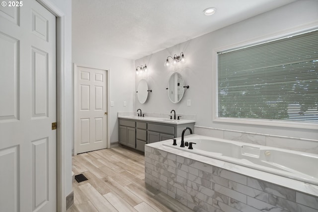 17958 Saint Clair Dr, Lake Oswego, OR 97034 - full bath with double vanity, tiled bath, and wood finished floors