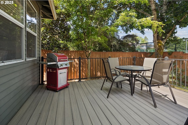 17958 Saint Clair Dr, Lake Oswego, OR 97034 - wooden deck with outdoor dining area, area for grilling, and a fenced backyard