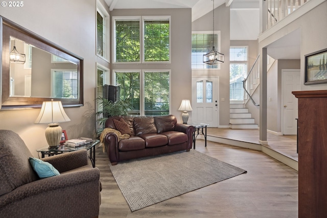 17958 Saint Clair Dr, Lake Oswego, OR 97034 - living room featuring a high ceiling, wood finished floors, and stairs