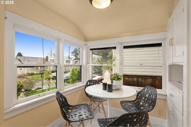 sunroom / solarium with vaulted ceiling