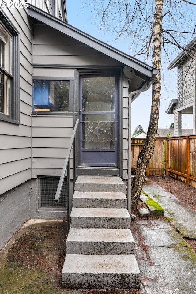 property entrance with fence