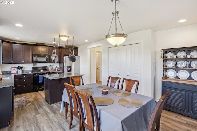 dining area with light wood-type flooring