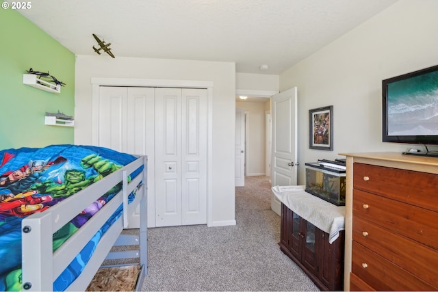 carpeted bedroom with a closet