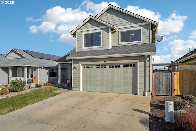 view of front of home with a porch and a garage