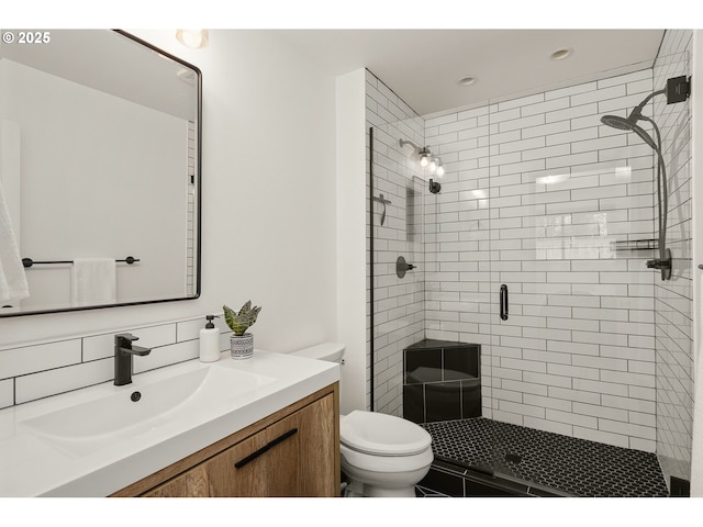 bathroom featuring vanity, recessed lighting, toilet, and a shower stall