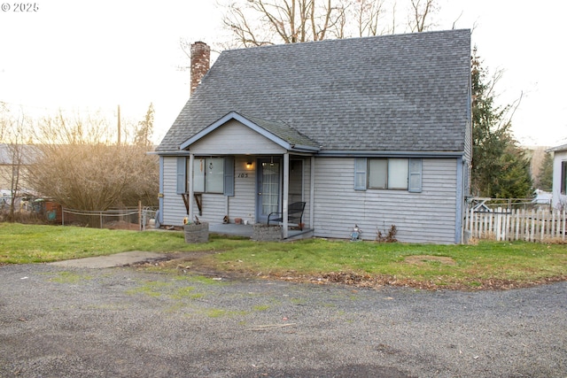 bungalow-style home featuring a front yard