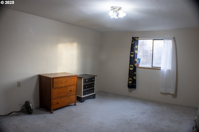 unfurnished bedroom with light colored carpet