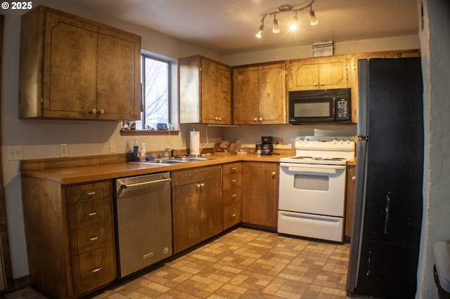 kitchen with sink and black appliances