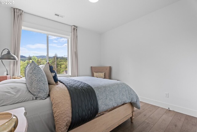 50322 Briarwood Ct, Scappoose, OR 97056 - bedroom with wood-type flooring and a mountain view