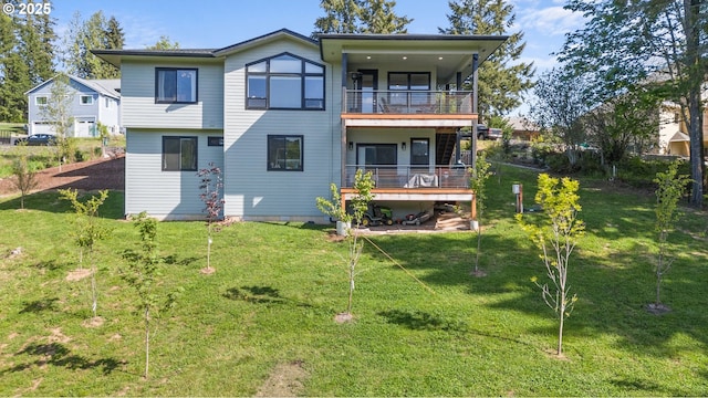 50322 Briarwood Ct, Scappoose, OR 97056 - rear view of house featuring a balcony and a lawn