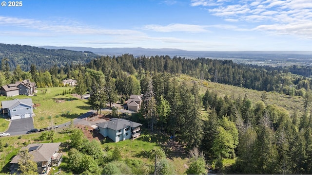 50322 Briarwood Ct, Scappoose, OR 97056 - aerial perspective of suburban area with a heavily wooded area and a mountainous background