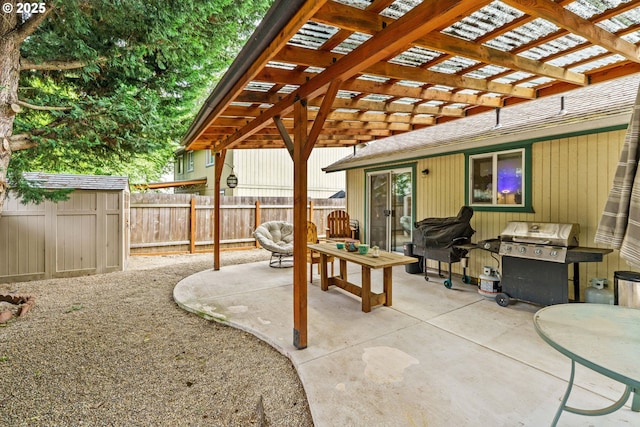 3318 Pinyon St, Springfield, OR 97478 - fenced backyard with grilling area, a pergola, a patio area, and an outdoor structure