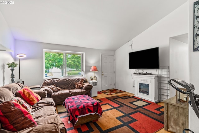 3318 Pinyon St, Springfield, OR 97478 - living room featuring lofted ceiling, wood finished floors, and a glass covered fireplace