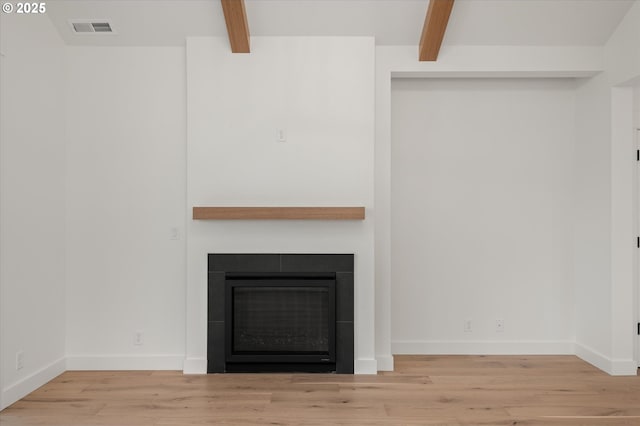 details with beamed ceiling and hardwood / wood-style flooring