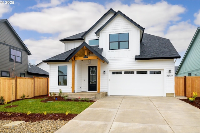 modern farmhouse style home featuring a front lawn and a garage