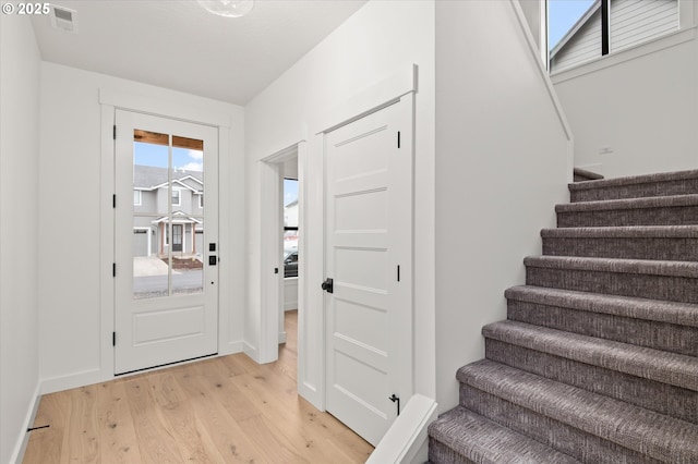 entrance foyer with light hardwood / wood-style flooring