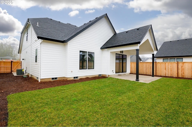 rear view of house featuring a lawn, central AC unit, and a patio