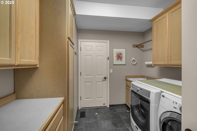 laundry room featuring separate washer and dryer, sink, and cabinets