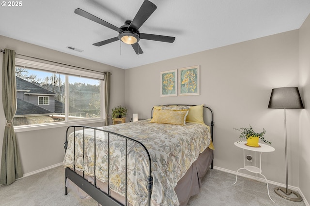 bedroom featuring light carpet and ceiling fan