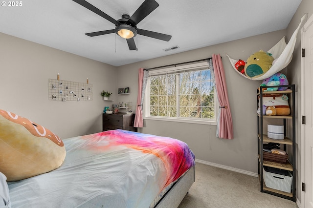 bedroom with light colored carpet and ceiling fan