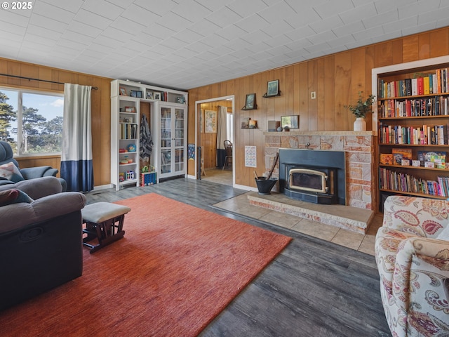 1749 NE 19th St, Lincoln City, OR 97367 - living area with wooden walls, a wood stove, and wood finished floors