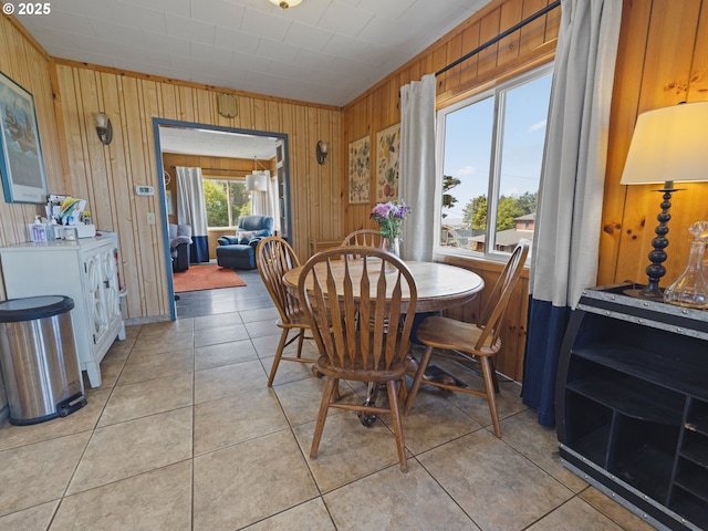 1749 NE 19th St, Lincoln City, OR 97367 - dining room featuring wooden walls and light tile patterned floors