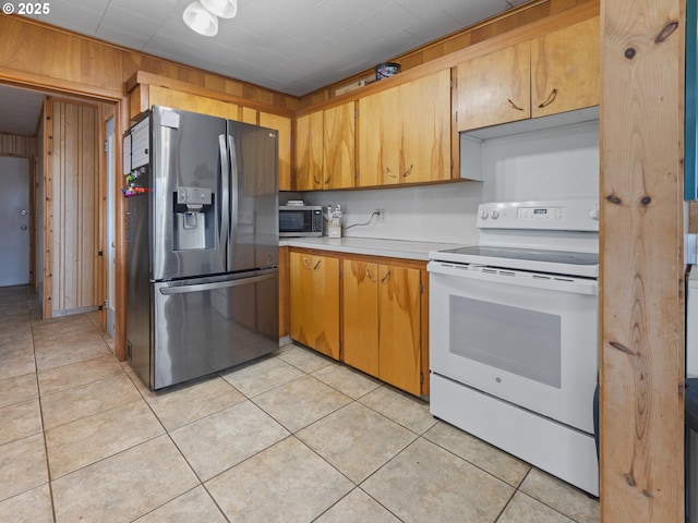 1749 NE 19th St, Lincoln City, OR 97367 - kitchen featuring appliances with stainless steel finishes, light countertops, and light tile patterned floors