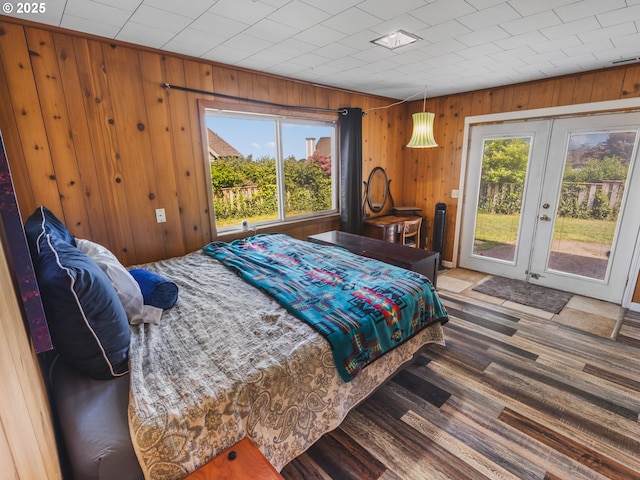 1749 NE 19th St, Lincoln City, OR 97367 - bedroom featuring access to outside, french doors, wooden walls, and wood finished floors