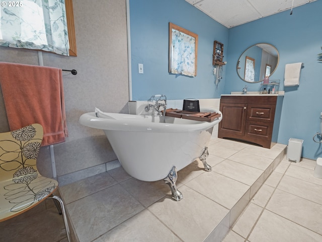 1749 NE 19th St, Lincoln City, OR 97367 - bathroom featuring a freestanding tub, vanity, tile patterned floors, and a paneled ceiling