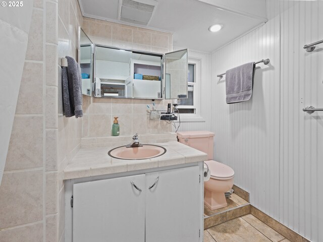 1749 NE 19th St, Lincoln City, OR 97367 - bathroom featuring toilet, vanity, and tile patterned flooring