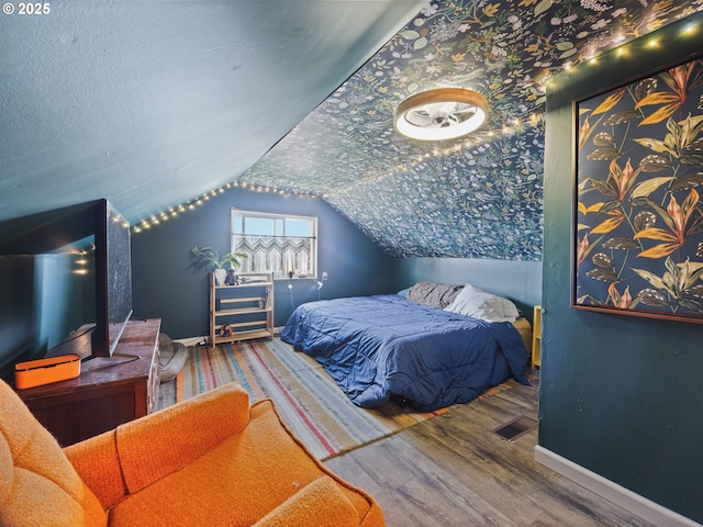1749 NE 19th St, Lincoln City, OR 97367 - bedroom with baseboards, wood finished floors, and lofted ceiling