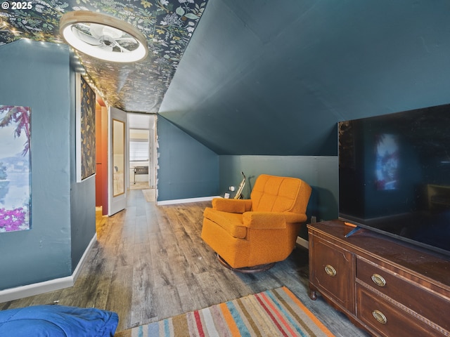 1749 NE 19th St, Lincoln City, OR 97367 - living area with lofted ceiling, wood finished floors, and baseboards