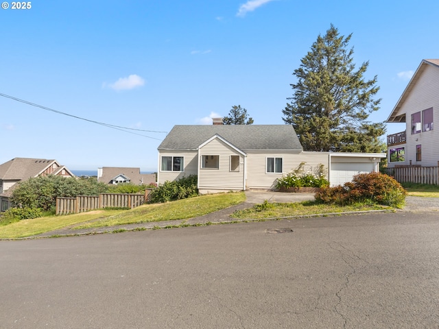 1749 NE 19th St, Lincoln City, OR 97367 - view of front of house featuring a chimney and a garage