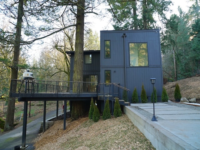 back of house featuring a deck