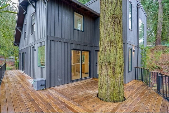 rear view of property with board and batten siding