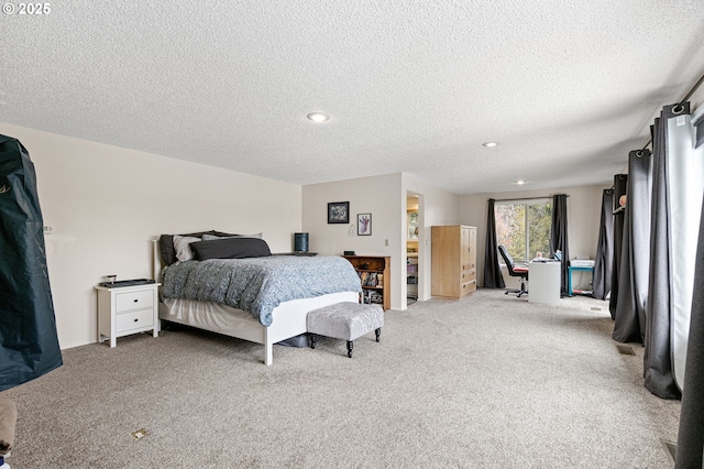 carpeted bedroom featuring a textured ceiling