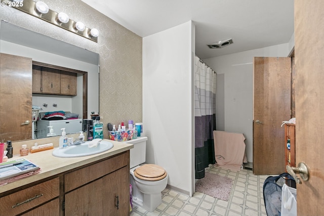 bathroom with tile patterned floors, visible vents, toilet, baseboards, and vanity