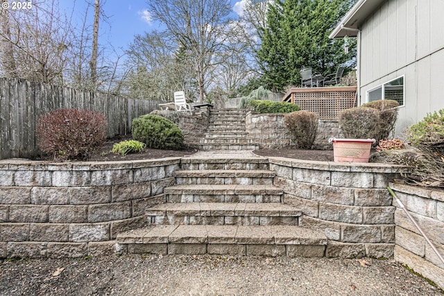 exterior details featuring stairs and fence