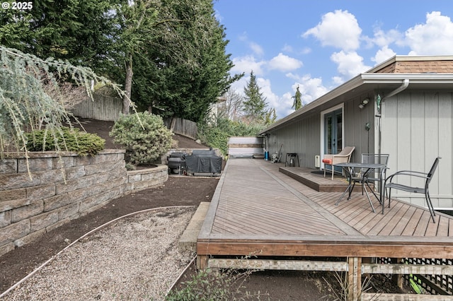 deck with a fenced backyard