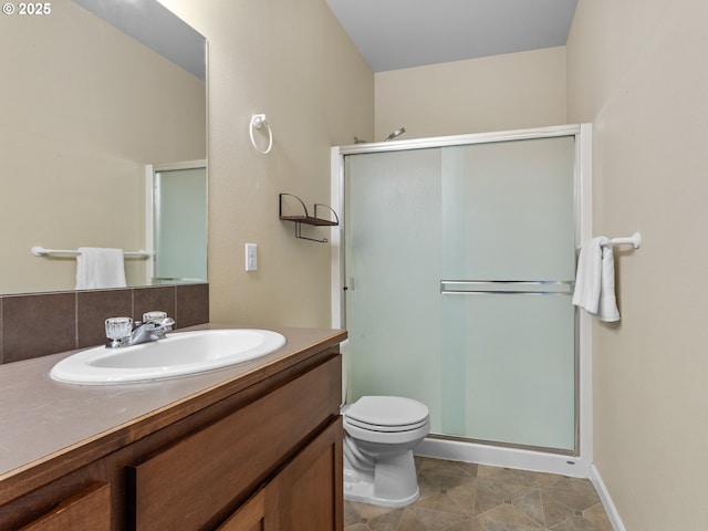 full bath featuring tasteful backsplash, toilet, a stall shower, and vanity