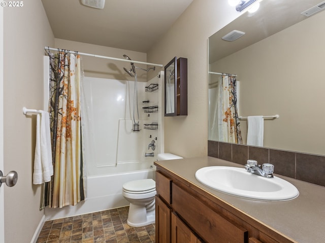 bathroom featuring visible vents, stone finish flooring, toilet, vanity, and shower / bathtub combination with curtain